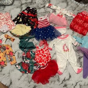 Lot of NEW American girl clothes with carrying case.